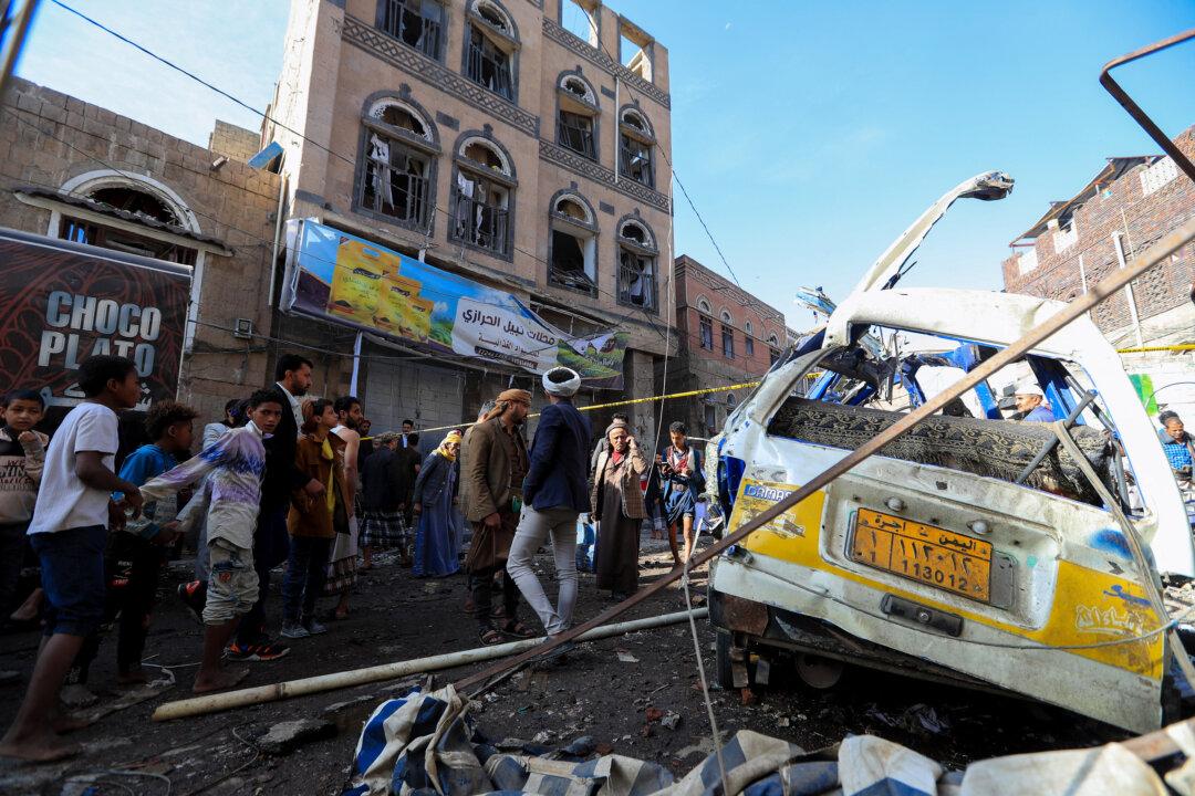 People assess the damage caused by a U.S. airstrike in a neighborhood in the Houthi-controlled Yemeni capital of Sanaa on April 21, 2025. (Mohammed Huwais/AFP via Getty Images)