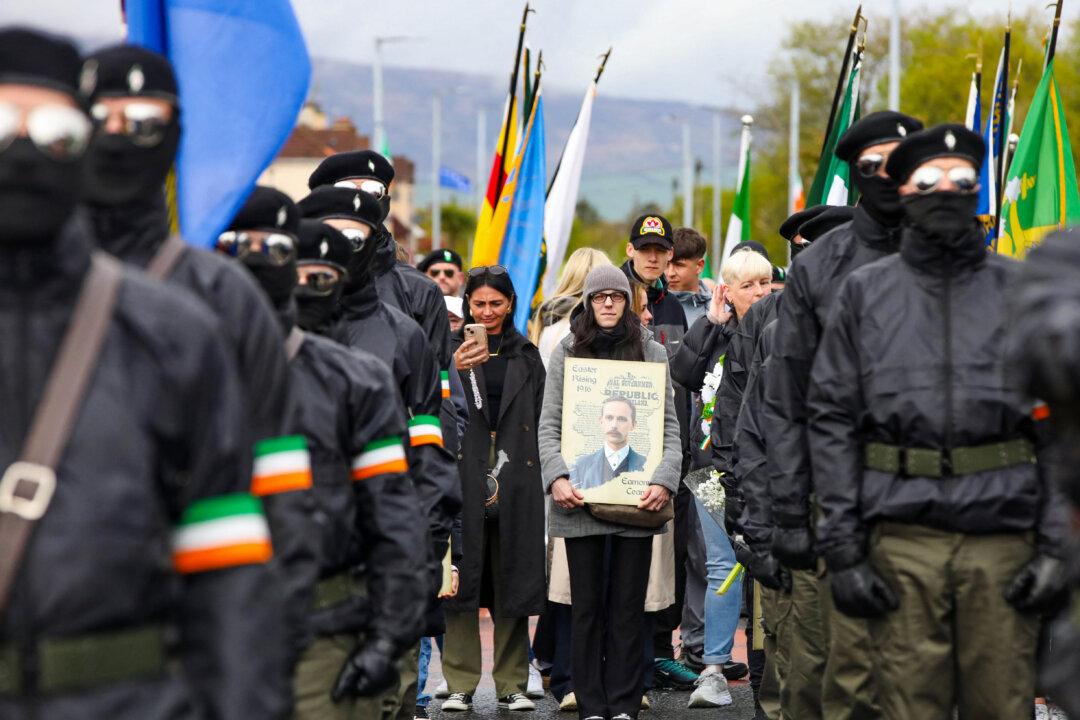Masked members of a dissident Republican Colour Party take part in a commemorative march in Londonderry, Northern Ireland, on April 21, 2025, to commemorate the 1916 Easter Rising by Irish republicans opposing British rule. (Paul Faith/AFP via Getty Images)