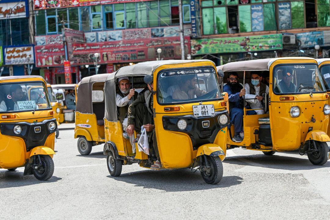 Afghan men travel in auto rickshaws in the city of Jalalabad, on April 21, 2025. (Wakil Kohsar/AFP via Getty Images)