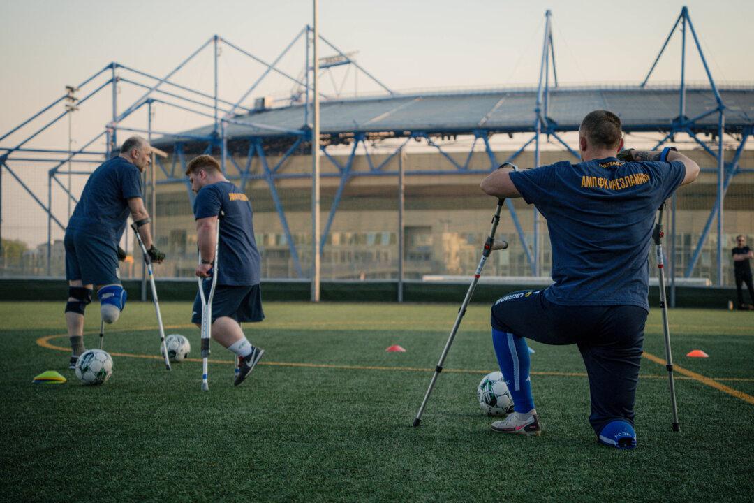 Veterans and civilians with amputated limbs attend a training session of the soccer team “Unbreakable” on a field at the Metalist Stadium in Kharkiv, Ukraine, on April 21, 2025. The soccer club was founded a month ago by veterans of the Russian-Ukrainian war, for veterans and civilians with amputated limbs. So far, the team has held six training sessions and is preparing for future tournaments. (Ivan Samoilov/AFP via Getty Images)