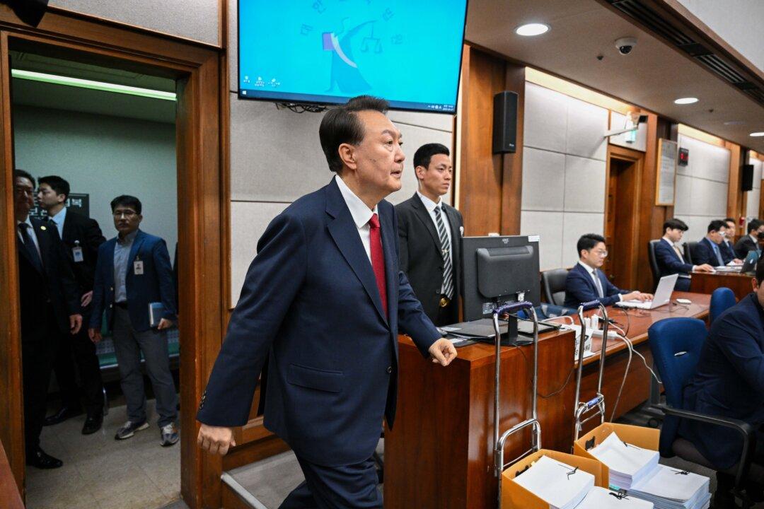 Former South Korean President Yoon Suk Yeol arrives for his criminal trial on insurrection charges at a courtroom in the Seoul Central District Court in Seoul, South Korea, on April 21, 2025. (Jung Yeon-Je - Pool/Getty Images)