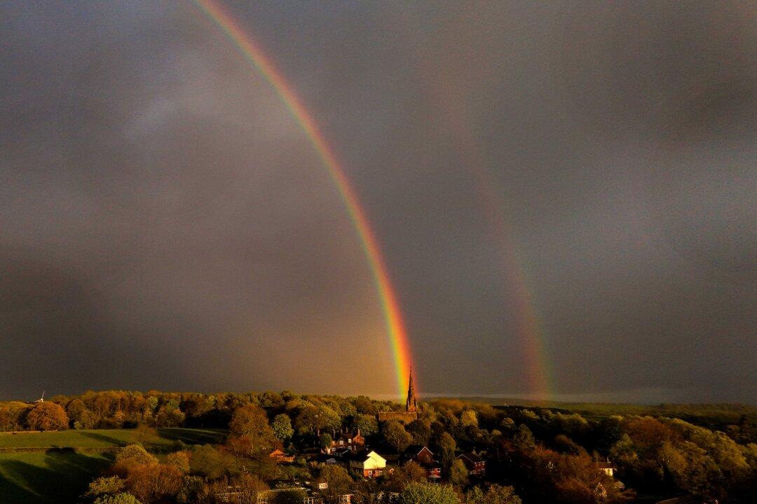 A rainbow is seen over St. John the Baptist church in Keele, United Kingdom, on April 21, 2025. (Carl Recine/Getty Images)