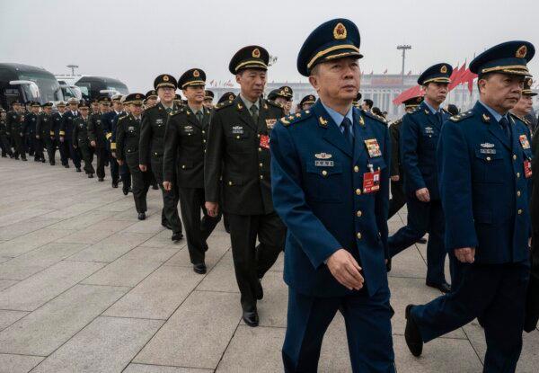 Delegates from the Chinese military seen before the closing session of China's rubber-stamp legislature, the National People's Congress, at the Great Hall of the People in Beijing on March 11, 2025. (Kevin Frayer/Getty Images)