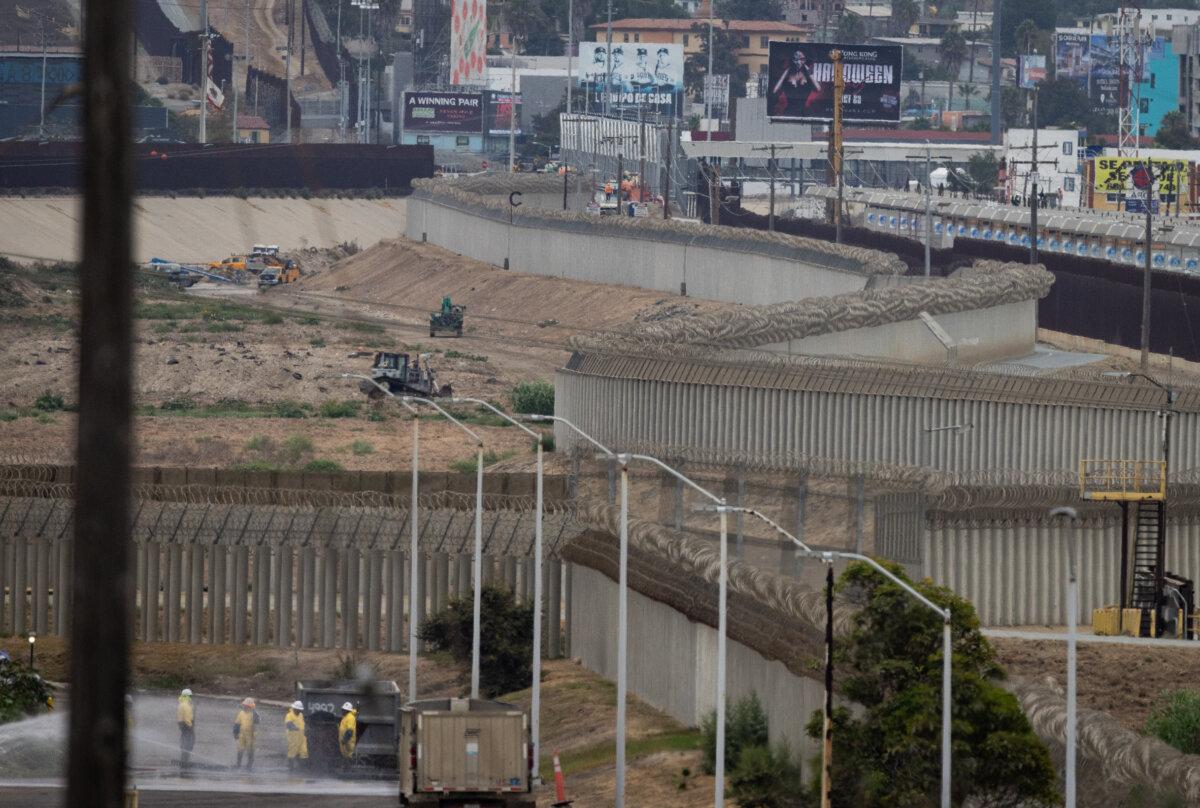 Crews work on the Tijuana River outside of San Diego on Sept. 19, 2024. (John Fredricks/The Epoch Times)