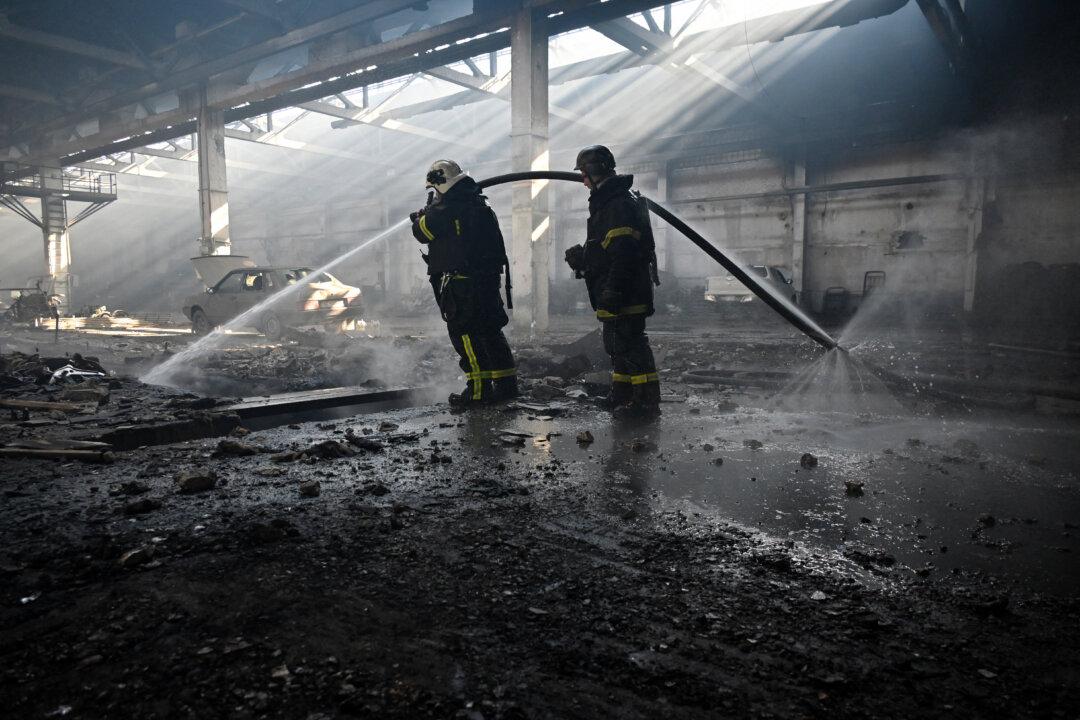Firemen work inside the workshop of a private company following a Russian drone strike in Kharkiv, Ukraine, on April 22, 2025. (Sergey Bobok/AFP via Getty Images)