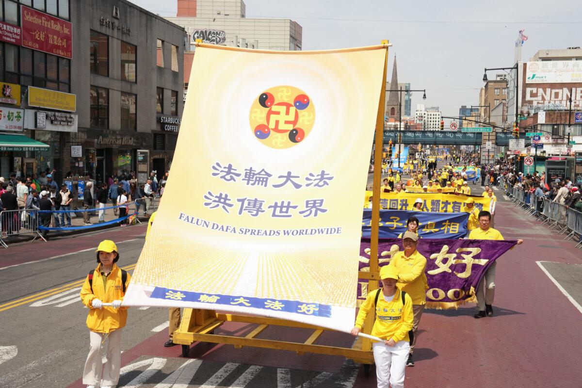 Falun Gong practitioners take part in a parade to commemorate the 26th anniversary of the April 25 appeal, in Flushing, New York, on April 19, 2025. (Larry Dye/The Epoch Times)
