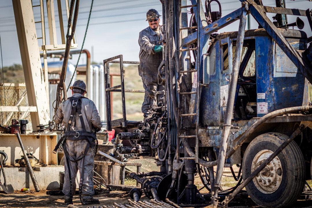 Oil specialists keep pumps running outside of Bakersfield, Calif., on March 21, 2025. Energy strategist Skip York told The Epoch Times that new drilling permits in Kern County have dropped from thousands to dozens. (John Fredricks/The Epoch Times)