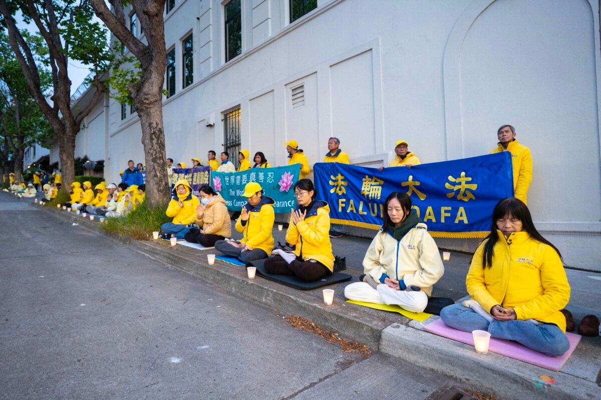 Practitioners meditating during a demonstration in front of the Chinese Consulate in San Francisco on April 25, 2025. (Gary Wang/The Epoch Times)