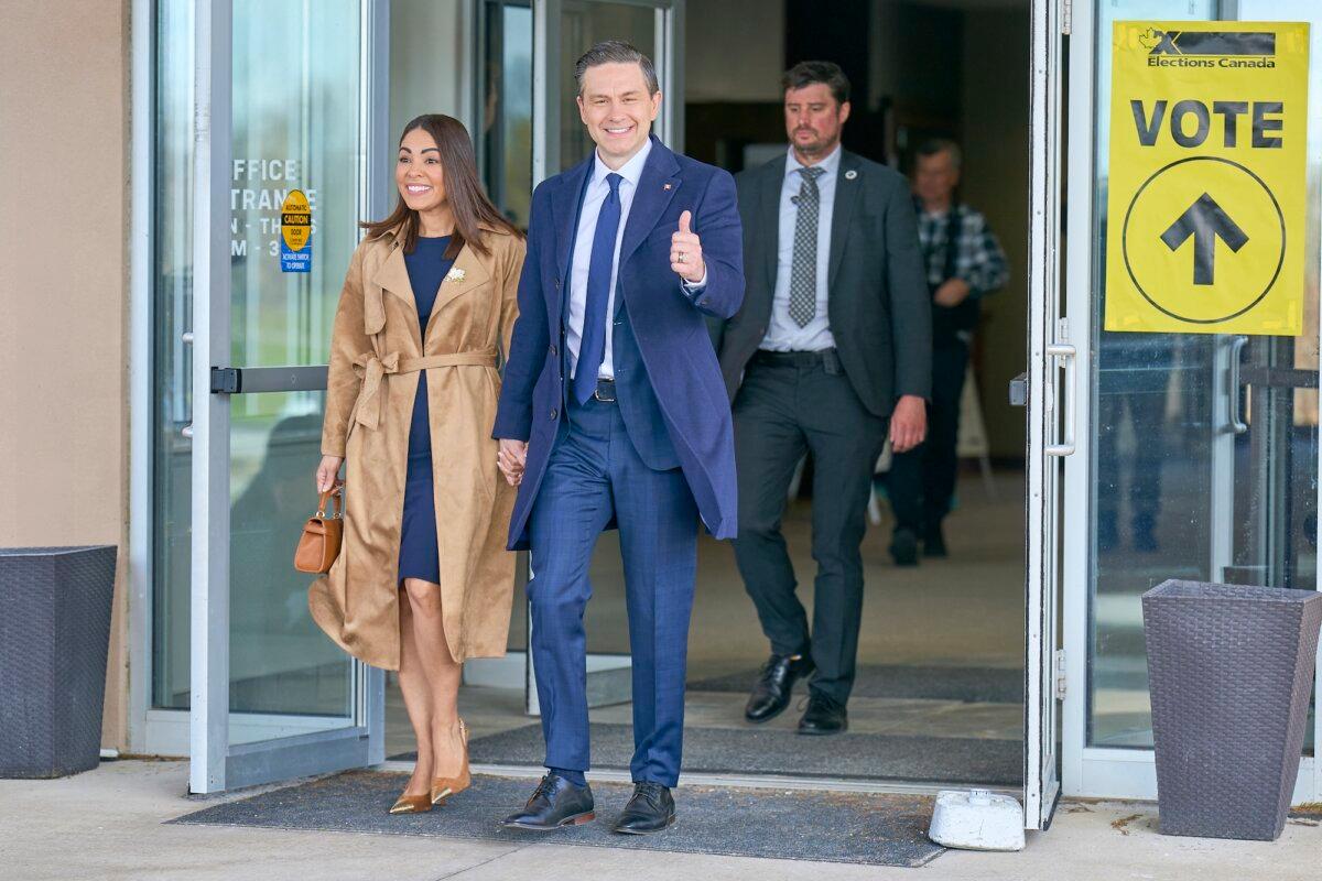 Conservative leader Pierre Poilievre gives a thumbs up as he and his wife, Anaida, depart a polling place after voting in Ontario, Canada, on April 28, 2025. (Geoff Robins / AFP)