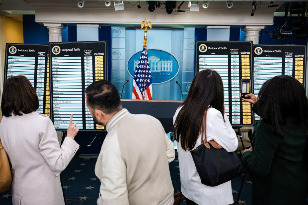 Charts showing the reciprocal tariffs the United States is imposing on other countries are displayed at the White House on April 2, 2025. During an event in the Rose Garden, President Donald Trump announced sweeping new tariffs on imports from countries including China, Japan, and India. (Alex Wong/Getty Images)