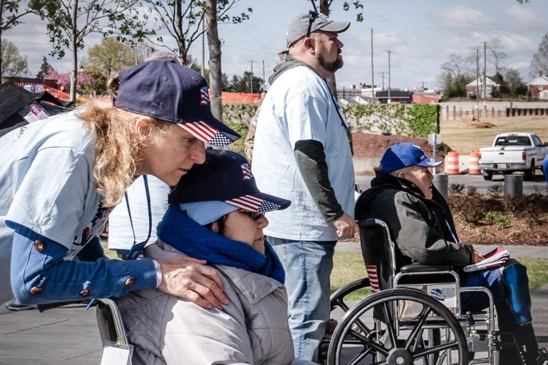 (Top) Veteran George Walker and his son at the Vietnam Veterans Memorial in Washington on April 8, 2025. (Bottom L) Veterans pose for a photograph at the Air Force Memorial in Arlington, Va., on April 8, 2025. (Bottom R) Veterans visit the Air Force Memorial in Arlington, Va., on April 8, 2025. (Madalina Vasiliu/The Epoch Times)