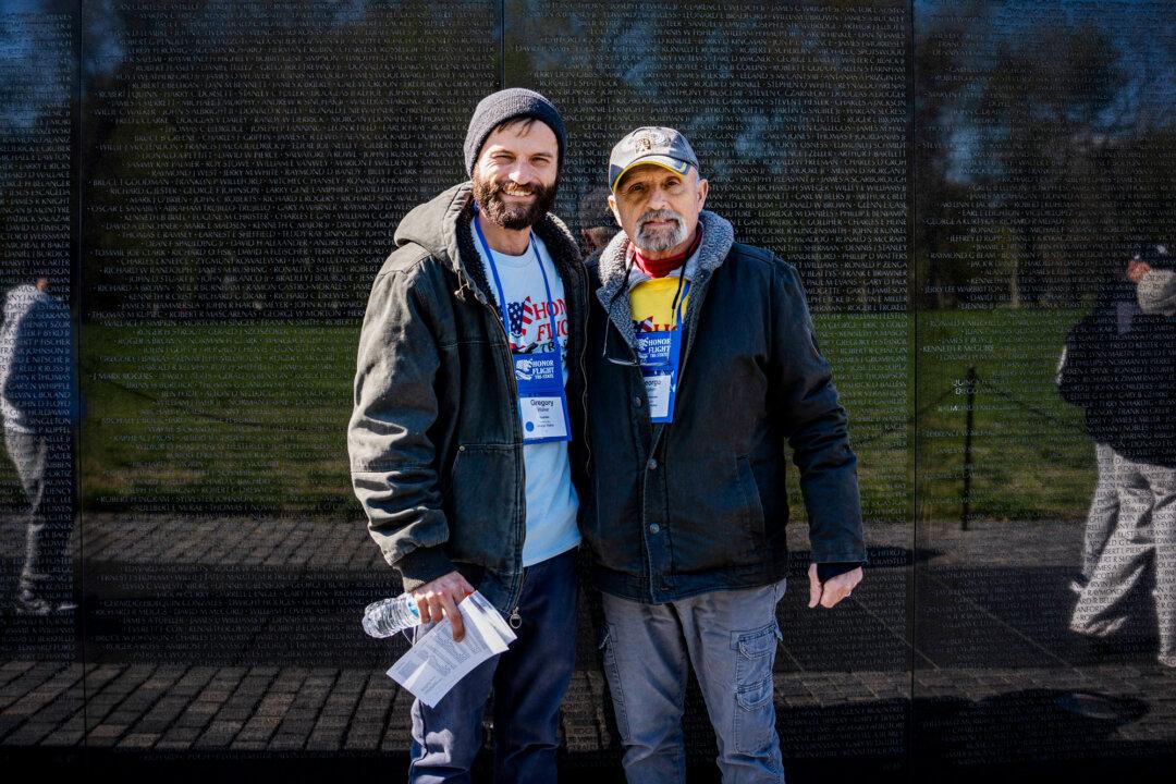 Veteran George Walker and his son at the Vietnam Veterans Memorial in Washington on April 8, 2025. Honor Flight Tri-State brought veterans from Ohio, Kentucky, and Indiana on a day trip to Washington to visit the capital's war memorials. (Madalina Vasiliu/The Epoch Times)