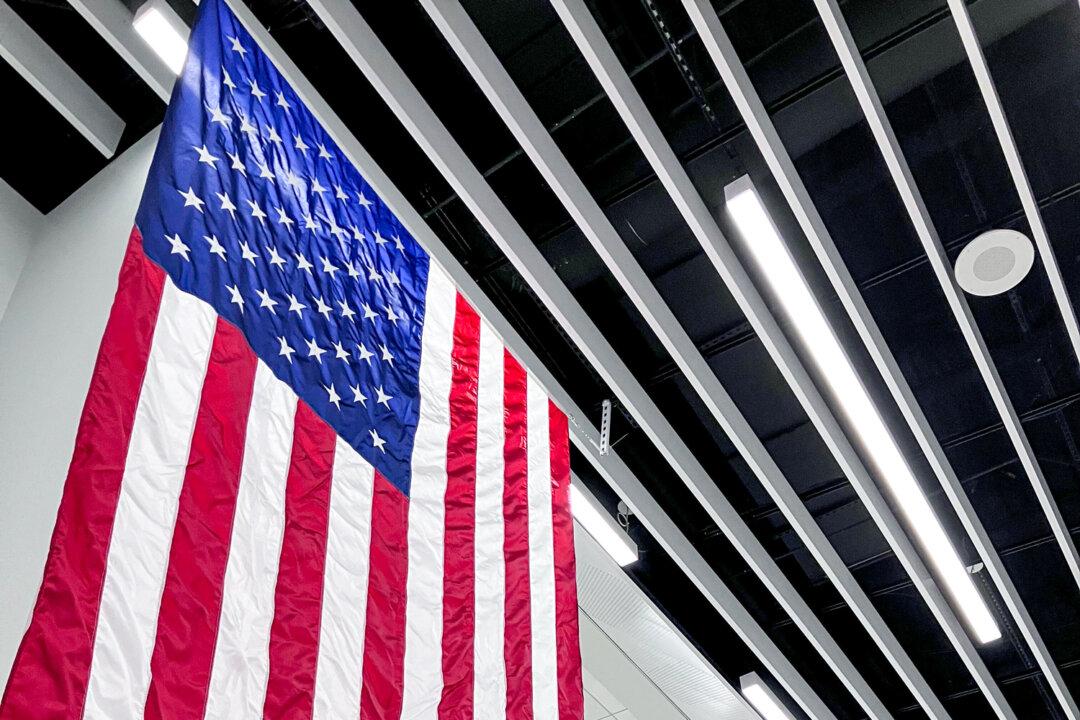 Cheryl Popp, CEO of Cincinnati-based nonprofit Honor Flight Tri-State, speaks before the group takes off from the Cincinnati & Northern Kentucky International Airport on April 8, 2025. (Janice Hisle/The Epoch Times)