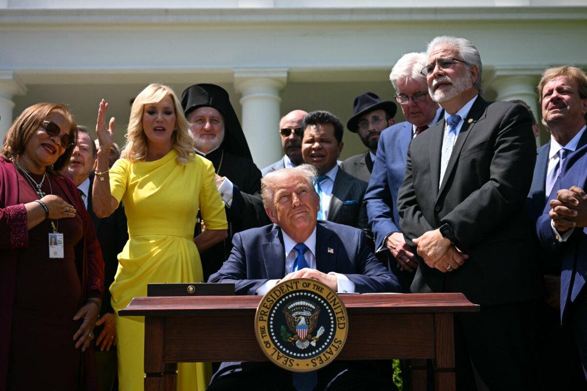 The Rev. Paula White (2nd L) and other faith leaders pray behind President Donald Trump during a National Day of Prayer event in the Rose Garden of the White House on May 1, 2025. (Jim Watson/AFP)