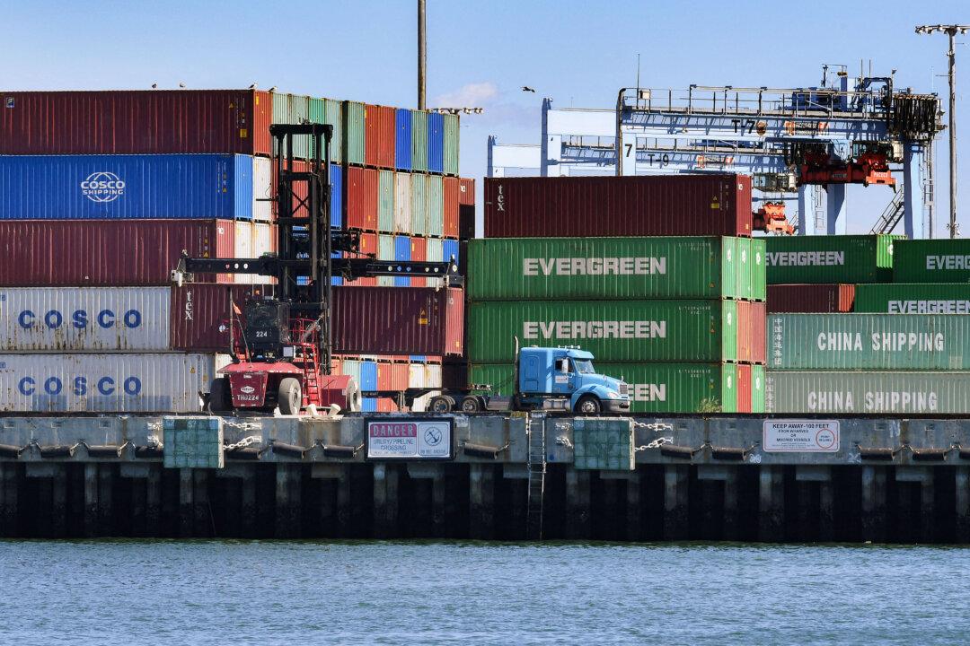 Shipping containers from China and other countries are unloaded at the Port of Long Beach in Los Angeles on Feb. 16, 2019. Since 2016, billions of small packages under $800 have entered the United States without tariffs under Section 321 of the Tarriff Act of 1930. (Mark Ralston/AFP via Getty Images)