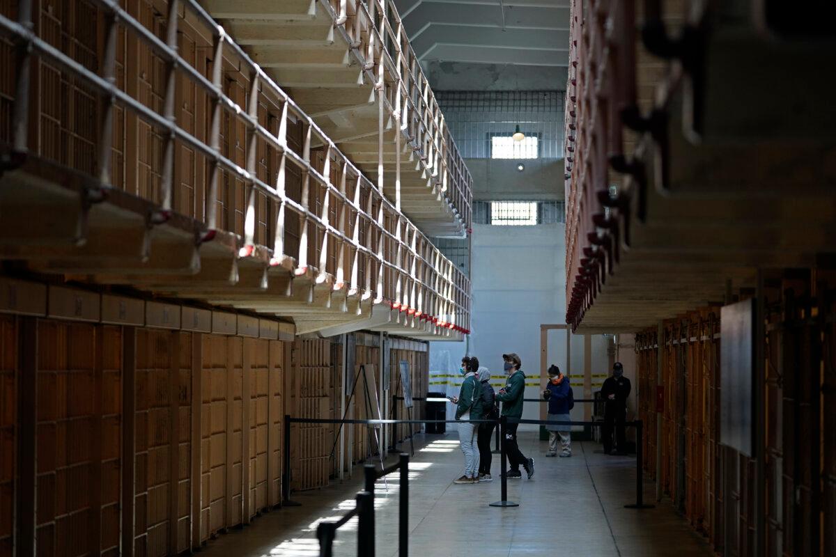 People tour the main cell house on Alcatraz Island in San Francisco on March 15, 2021. (Eric Risberg/AP Photo)