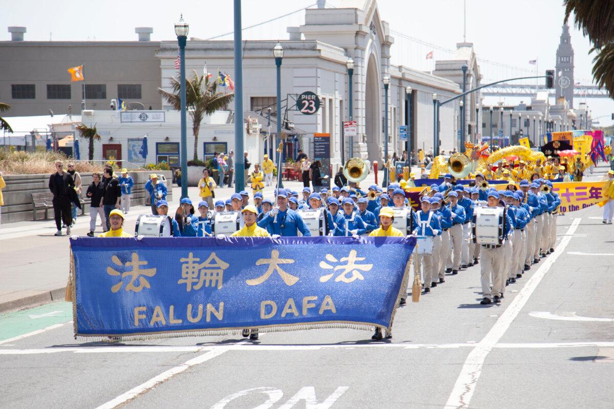 The Tianguo Marching Band leads a parade celebrating World Falun Dafa Day in San Francisco on May 3, 2025. (Lear Zhou/The Epoch Times)