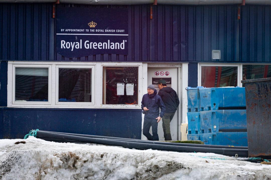 (Top) Fishermen travel Arctic waters near Nuuk, Greenland, on May 4, 2025. Shrimp and fish make up more than 90 percent of Greenland's current exports. (Bottom) Boaters leave the offices of Royal Greenland near Nuuk, Greenland, on May 5, 2025. (John Fredricks/The Epoch Times)