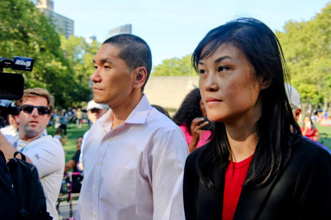 Linda Sun (R), a former aide to New York Gov. Kathy Hochul, and her husband, Chris Hu, exit the federal court in Brooklyn, New York City on Sept. 3, 2024. (Huang Xiaotang/The Epoch Times)
