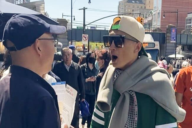 A Chinese man who identified himself as Fan Yang (R) confronted volunteers at a Global Service Center for Quitting the CCP booth in the Flushing neighborhood of Queens in New York on April 29, 2025. (Courtesy of Global Service Center for Quitting the CCP)