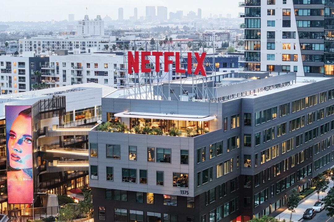 The Netflix logo is seen atop its corporate offices in Los Angeles on Jan. 24, 2024. President Donald Trump announced a 100 percent tariff on films produced abroad, but many modern productions involve multiple countries, making it difficult to determine their origin—especially for projects commissioned by platforms such as Netflix. (Mario Tama/Getty Images)