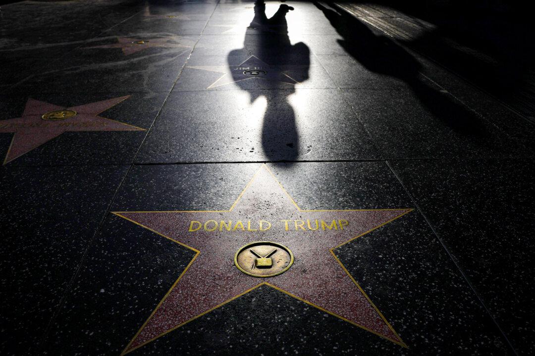 People walk past President Donald Trump's star along the Hollywood Walk of Fame in Los Angeles on April 17, 2024. (Mario Tama/Getty Images)