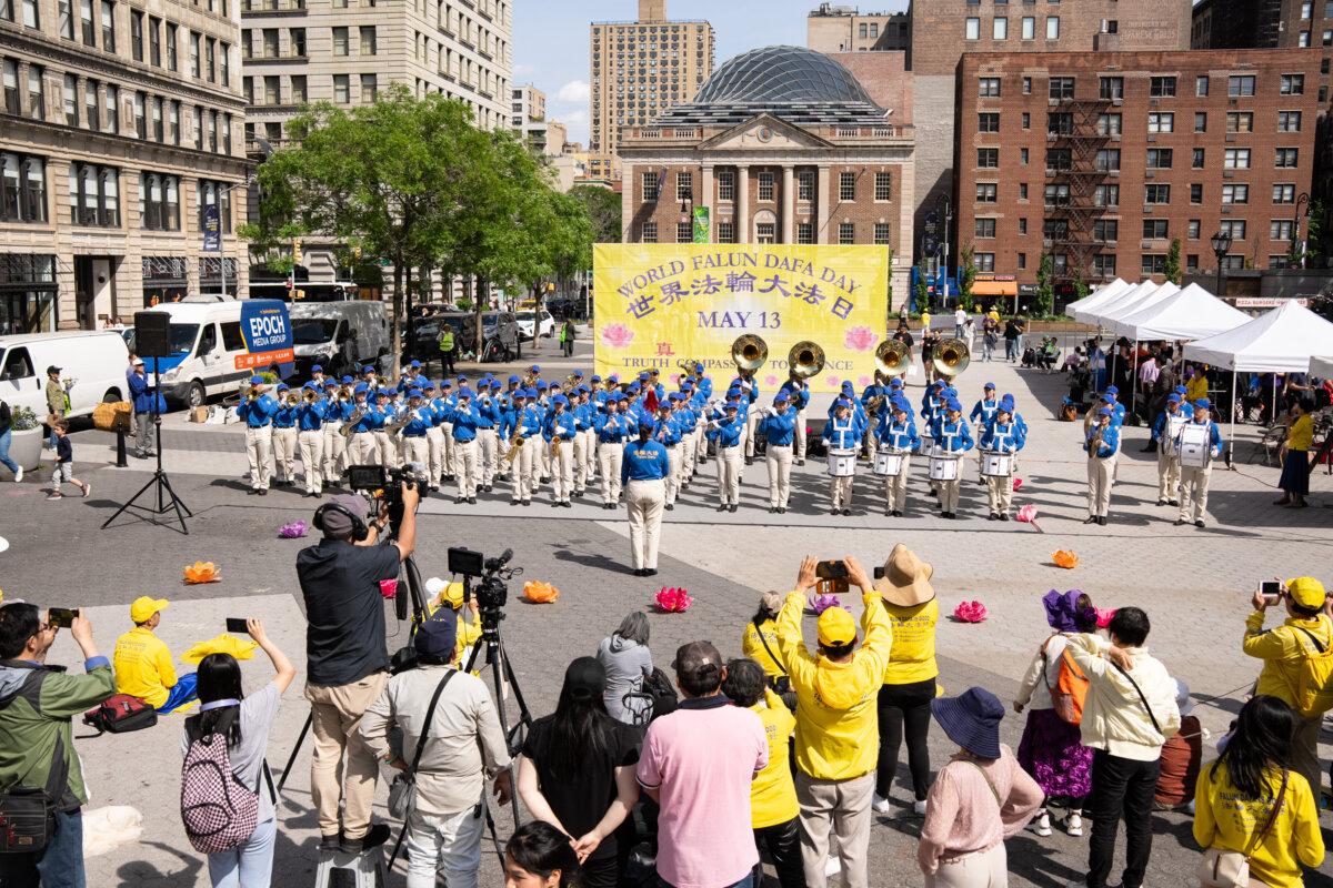 A marching band performs during World Falun Dafa Day celebrations at Union Square in New York City on May 11, 2025. (Larry Dye/The Epoch Times)
