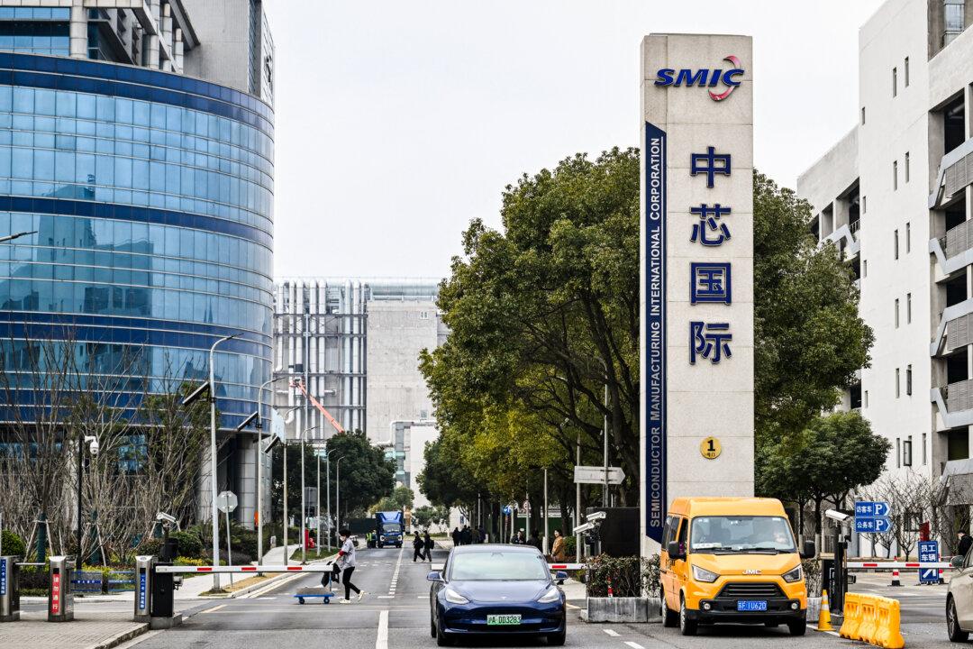 The Semiconductor Manufacturing International Corporation (SMIC) facilities in Shanghai’s Pudong district on March 15, 2024. Despite expanded U.S. export controls, China is investing billions into its semiconductor sector, pushing SMIC—its leading chipmaker—to rapidly expand advanced fabs for domestic chip production. (Hector Retamal/AFP via Getty Images)