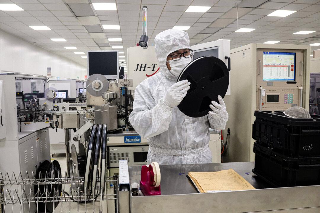 An employee inspects semiconductor chips at a factory in Binzhou, Shandong Province, China, on Jan. 15, 2025. The United States has sought to restrict China’s access to advanced semiconductors, warning they could strengthen the communist country’s military and surveillance systems. (STR/AFP via Getty Images)