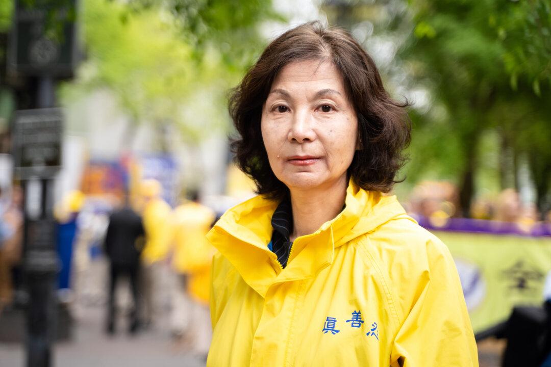 Mi Ruijing takes part in a parade marking the 30th anniversary since Falun Gong was introduced to the public, in New York City on May 13, 2022. (Samira Bouaou/The Epoch Times)