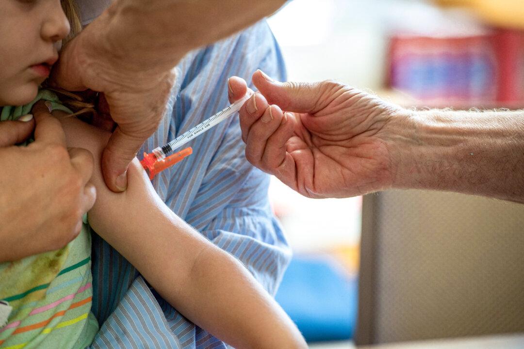 A young child receives a Moderna COVID-19 vaccination at Temple Beth Shalom in Needham, Mass., on June 21, 2022. (Joseph Prezioso/AFP via Getty Images)