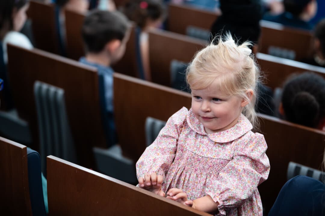 The child of a member of the press attends a mock press conference with White House press secretary Karoline Leavitt during Take Our Sons and Daughters to Work Day in the press briefing room of the White House on May 20, 2025. (Madalina Vasiliu/The Epoch Times)