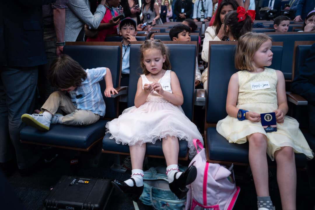 Children of members of the press ahead of a mock press conference with White House press secretary Karoline Leavitt during Take Our Sons and Daughters to Work Day in the press briefing room of the White House on May 20, 2025. (Madalina Vasiliu/The Epoch Times)