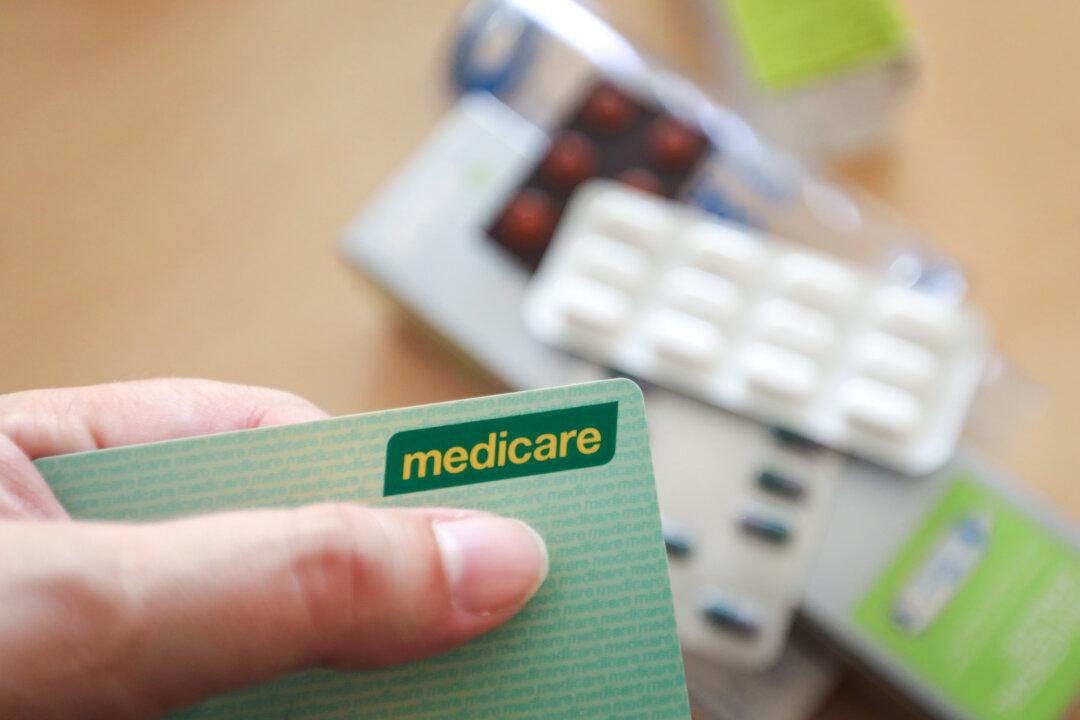In this photo illustration, an Australian Medicare card is displayed with prescription medicines in Sydney, Australia, on March 25, 2025. Since taking office in January, U.S. President Donald Trump has taken more than a dozen actions to lower prescription drug costs in the United States. Still, Americans pay nearly three times more for medications than other developed nations. (Lisa Maree Williams/Getty Images)