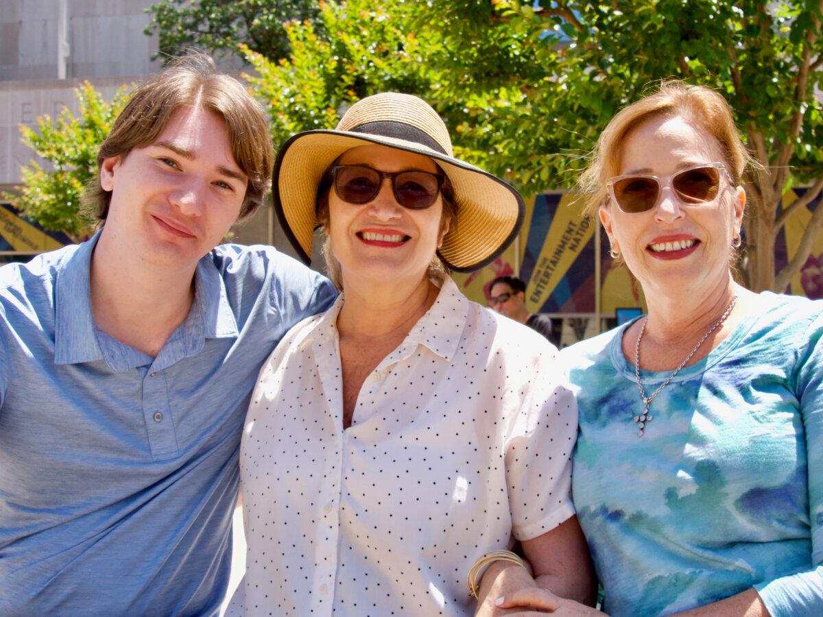 (L–R) John Lockwood, Olivia Lockwood, and Valery Parchment attend the National Memorial Day Parade in Washington on May 26, 2025, to see Parchment's son, Elijah Neale, perform in his role in the Coast Guard's prestigious Presidential Honor Guard. (Travis Gillmore/The Epoch Times)