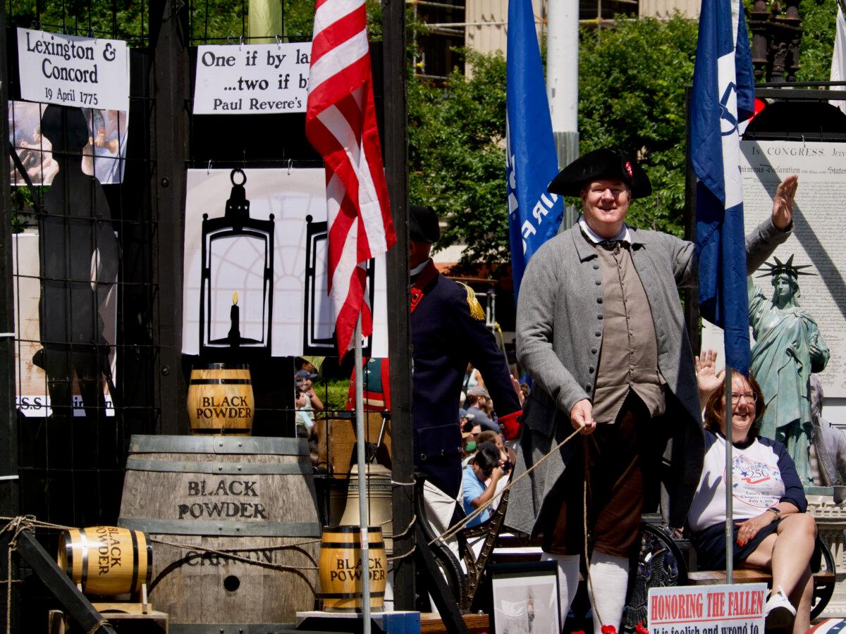 A float depicting historical figures at the National Memorial Day Parade in Washington on May 26, 2025. (Travis Gillmore/The Epoch Times)