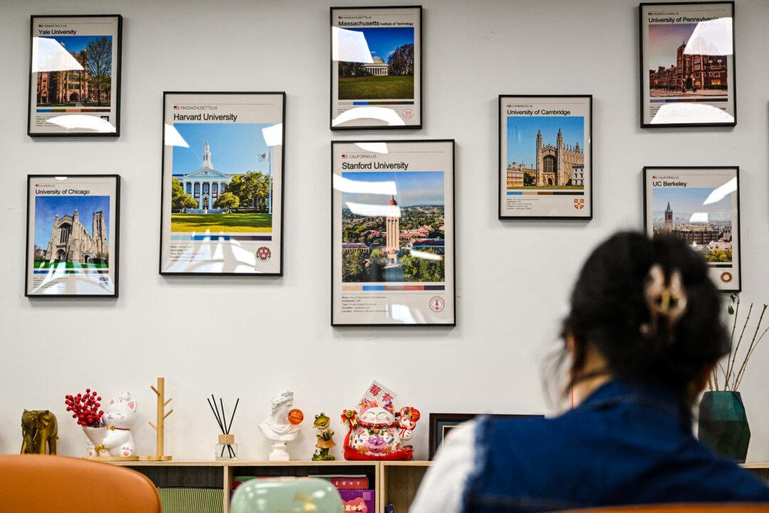 Posters of U.S. universities, including Harvard University, are displayed at an overseas education agency in Beijing on May 29, 2025. Beijing criticized the Trump administration's action to curb Chinese student visas. (Jade Gao/AFP via Getty Images)
