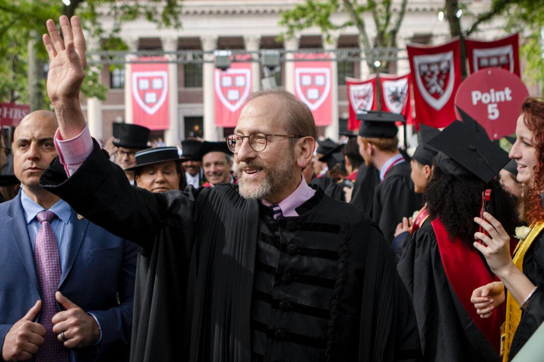 Harvard President Alan Garber arrives to speak at the 374th Harvard Commencement in Cambridge, Mass., on May 29, 2025. A group of U.S. lawmakers sent Garber a letter on May 19 seeking testimony and documents about Harvard’s ties to the Xinjiang Production and Construction Corps and other sanctioned Chinese entities. (Rick Friedman/AFP via Getty Images)