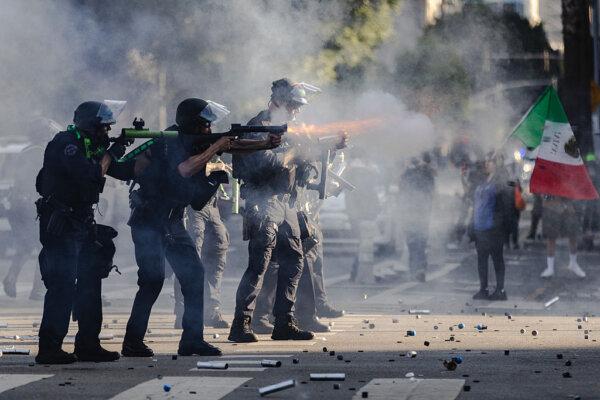 Police fire projectiles during clashes with protesters in downtown Los Angeles on June 8, 2025. (Jim Vondruska/Getty Images)