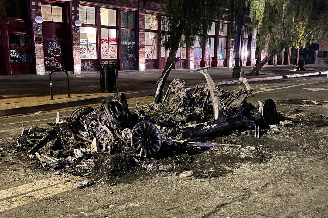 A burnt car in downtown Los Angeles on June 8, 2025. (Melina Chan/The Epoch Times)