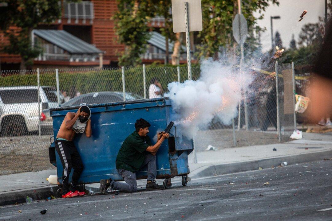 Protesters shoot fireworks in Paramount, Calif., on June 7, 2025. (Apu Gomes/Getty Images)