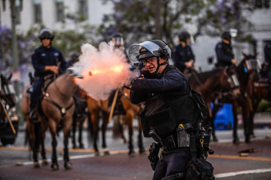 Los Angeles Police Department officers shoot rubber bullets at protesters in front of the City Hall in Los Angeles on June 8, 2025. (Apu Gomes/Getty Images)