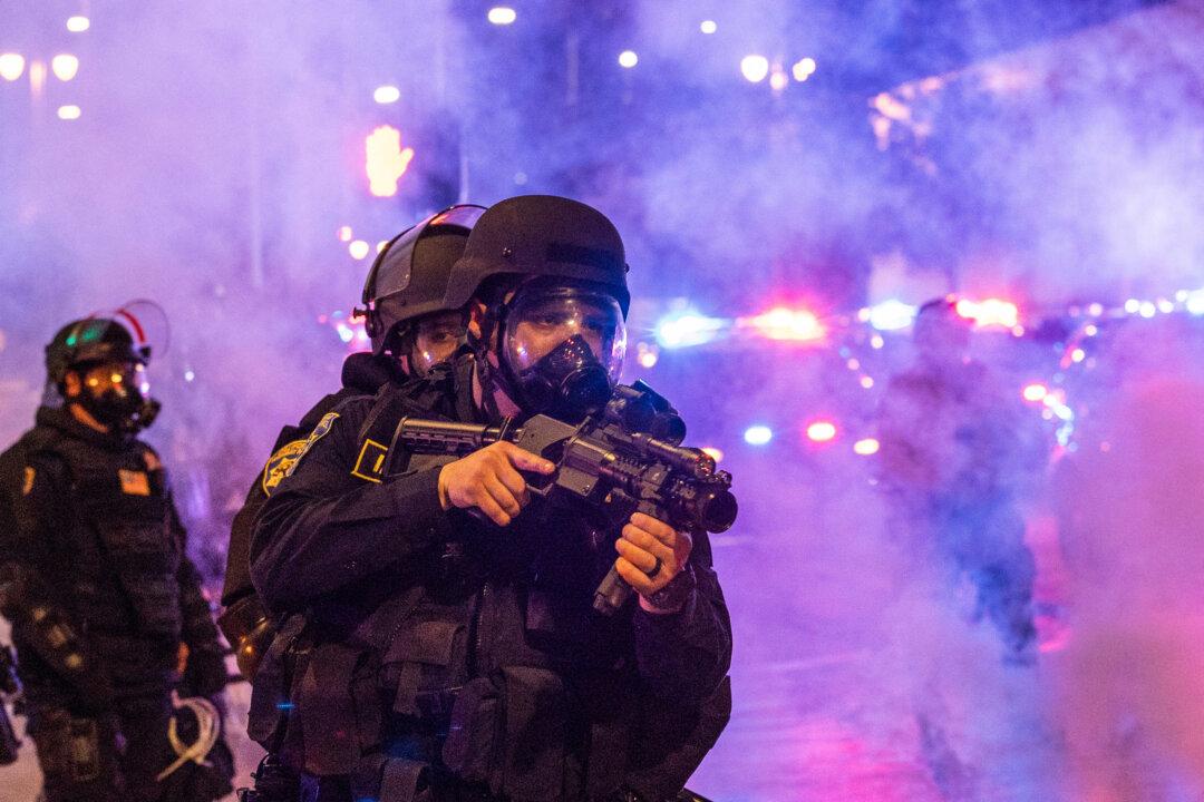 Law enforcement take positions on the streets surrounding the federal building during a protest following federal immigration operations in Los Angeles on June 8, 2025. (Ringo Chiu/AFP via Getty Images)