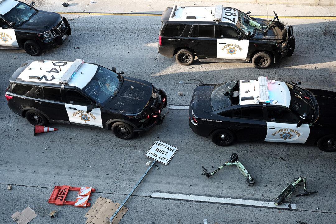 Damaged California Highway Patrol cars sit on the 101 freeway in Los Angeles on June 8, 2025. (Jim Vondruska/Getty Images)