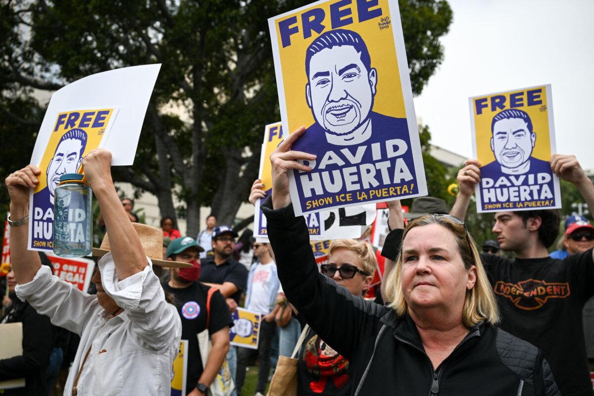 Demonstrators rally against US Immigration and Customs Enforcement (ICE) and call for the release of union leader David Huerta, President of SEIU California and SEIU-USWW, who was arrested on June 6 during federal immigration operations, at Gloria Molina Grand Park in Los Angeles, on June 9, 2025. (Ronaldo Schemidt/AFP via Getty Images)
