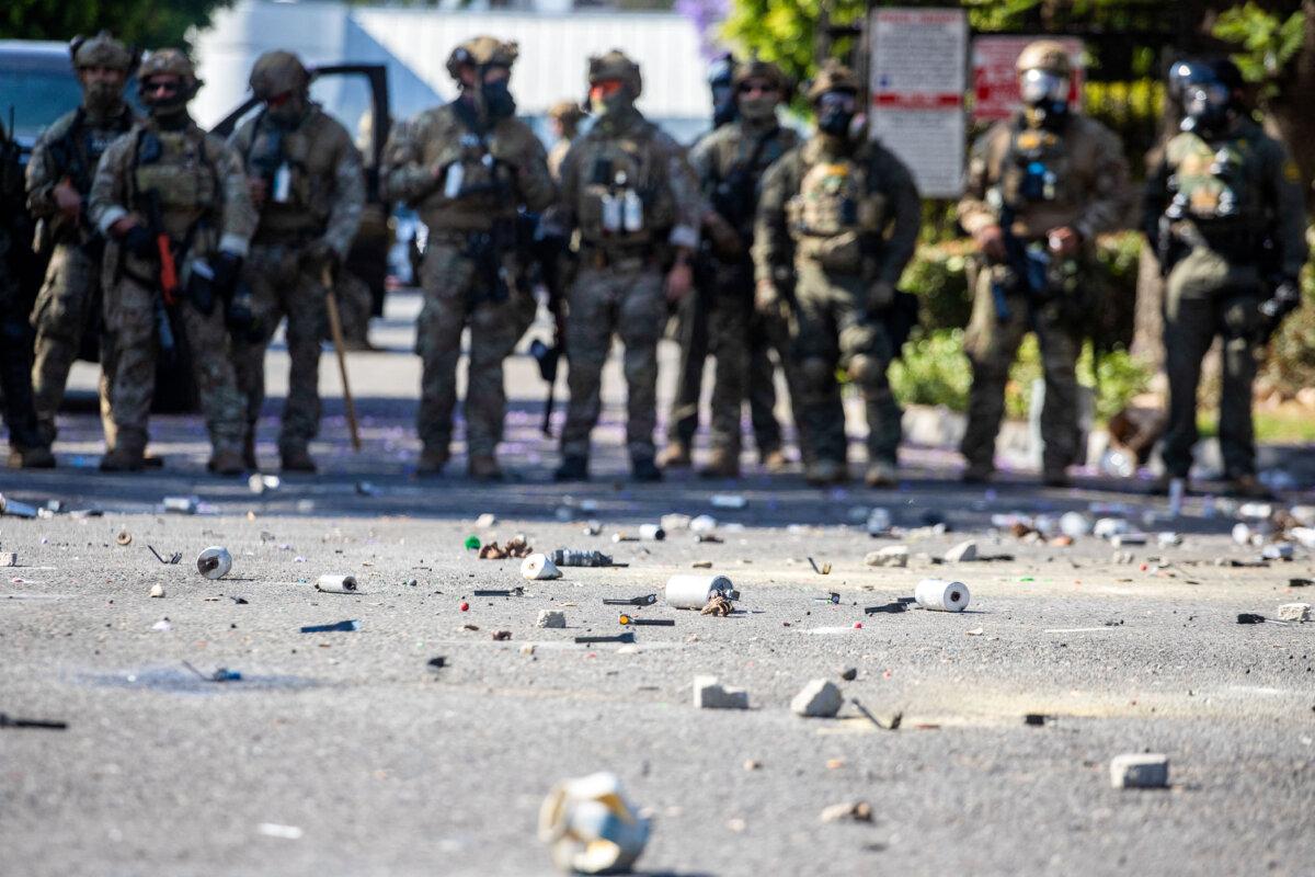 Tear gas canisters are seen on the street during a protest following federal immigration operations, in the Compton neighborhood of Los Angeles, Calif., early on June 7, 2025. (Ringo Chiu/AFP via Getty Images)