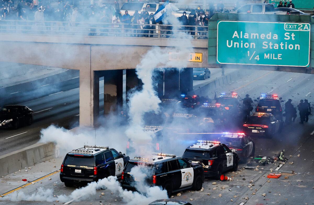 California Highway Patrol (CHP) cars, some damaged, are lined up along the 101 freeway after officers cleared protesters from the area in Los Angeles, Calif., on June 08, 2025. (Mario Tama/Getty Images)