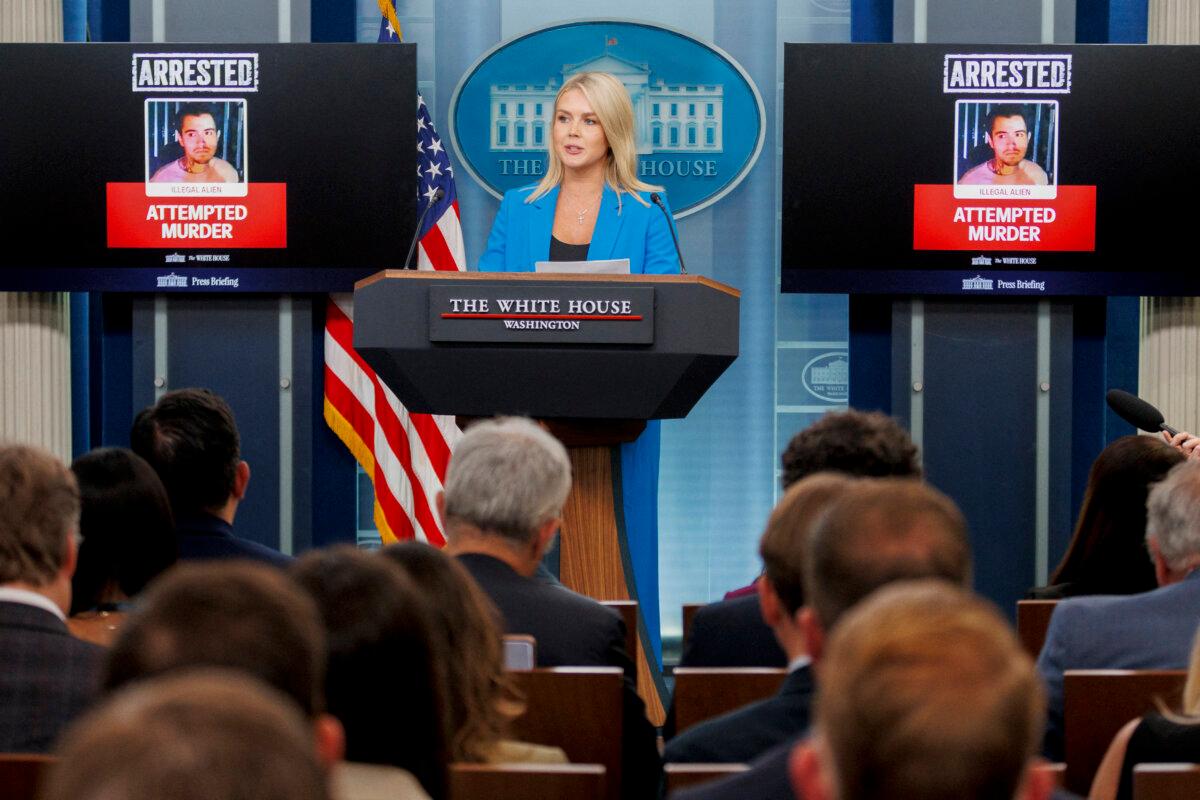 Flanked by images of a person arrested for violence during the ICE protests in Los Angeles, White House press secretary Karoline Leavitt speaks about President Donald Trump's response to the protests at the White House on June 11, 2025. (Bryan Dozier/Middle East Images via AFP via Getty Images)