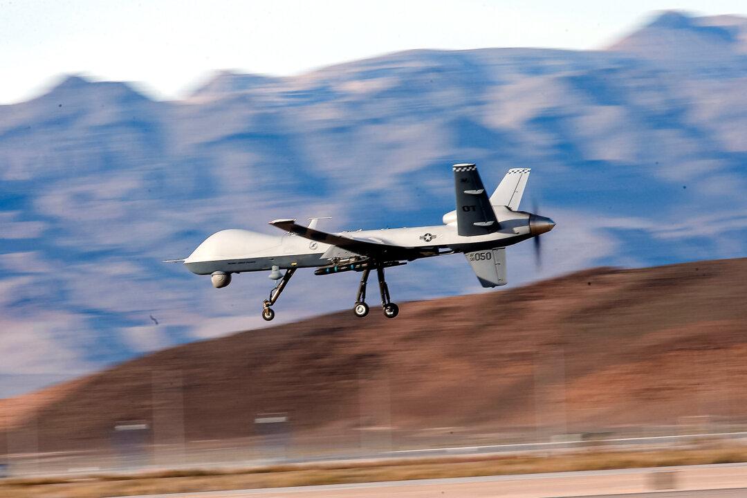 An MQ-9 Reaper remotely piloted aircraft (RPA) flies by during a training mission at Creech Air Force Base in Indian Springs, Nev., on Nov. 17, 2015. (Isaac Brekken/Getty Images)