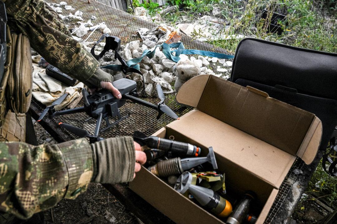 A Ukrainian soldier prepares a bomb for a drone during the Russian invasion in Bakhmut, Ukraine, on Sept. 25, 2022. Drones have played a key role for Ukraine in the war, including a high-profile June attack that struck air bases deep inside Russia, damaging or destroying 41 percent of its strategic cruise missile carriers, Ukrainian officials said. (Juan Barreto/AFP via Getty Images)